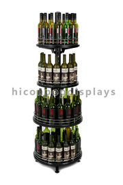 Porcellana Il dispositivo regolabile 4-Layer dell'esposizione del negozio di vino vende al dettaglio la forma rotonda della torre dell'esposizione del vino fornitore